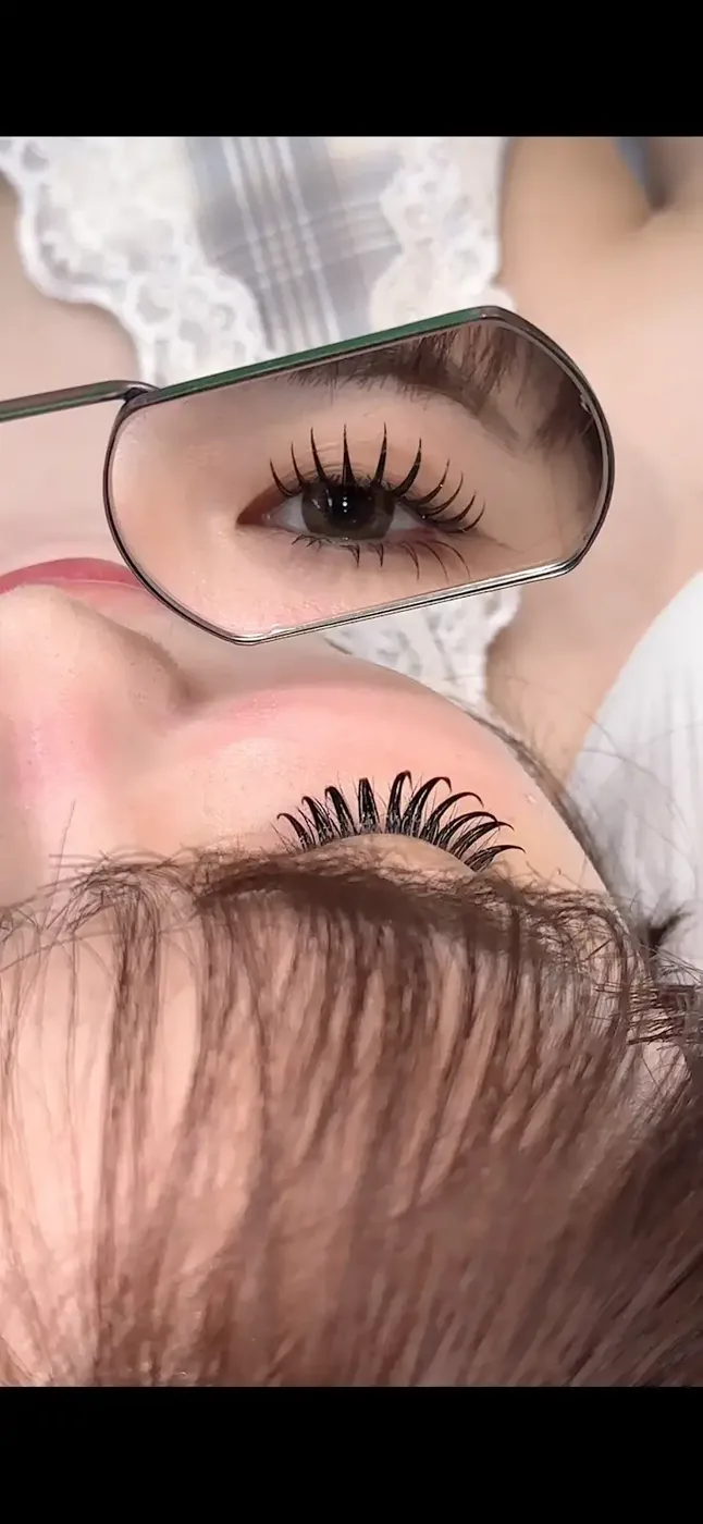 Lifted lash extensions on Asian eyes staying visible from the front view